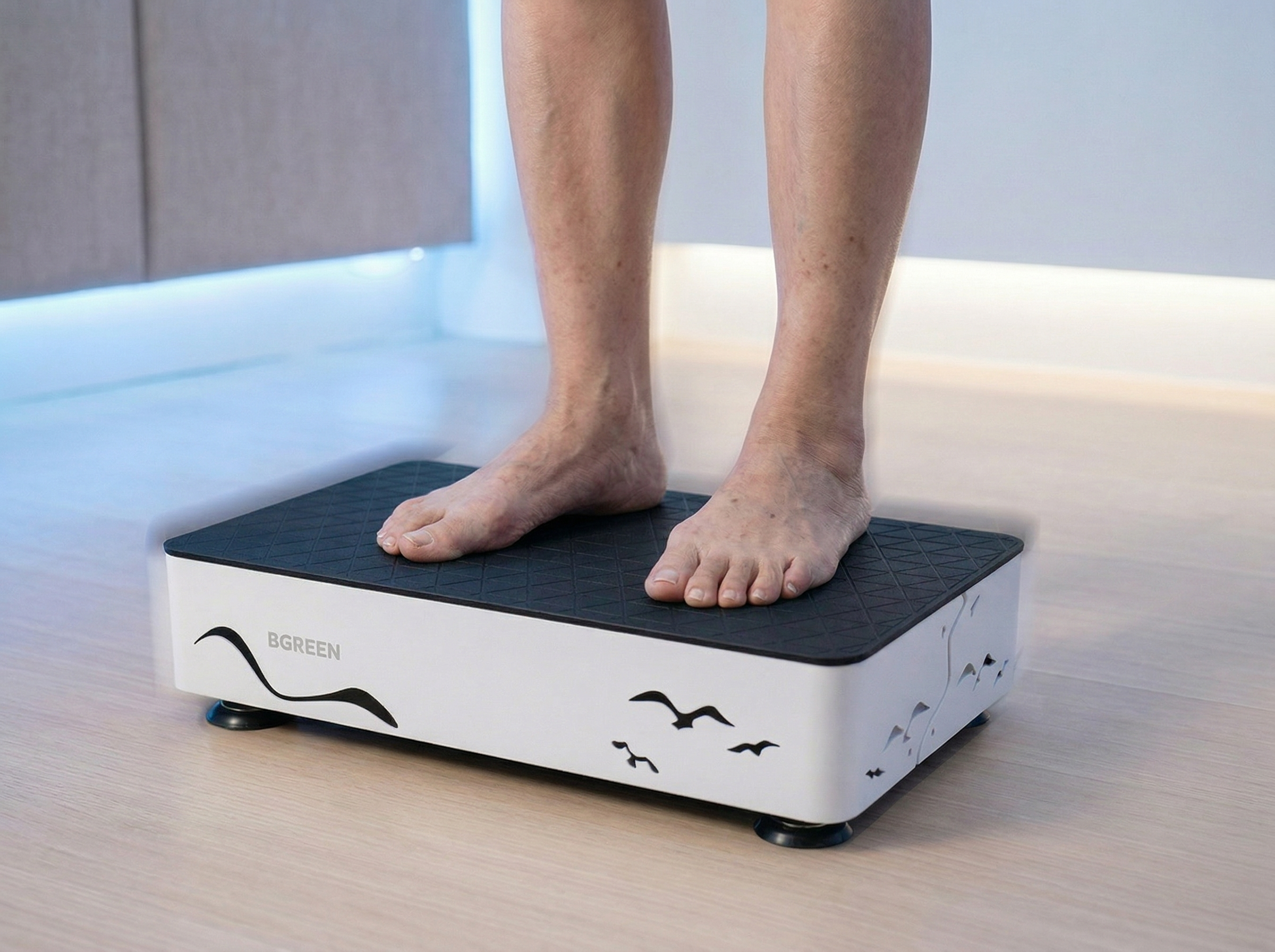 Close-up of feet on BGREEN whole body vibration WBVV platform at Vibrahealth Singapore โ passive exercise delivering muscle activation without effort